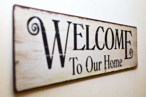 Welcome to our home print brown wooden wall decor