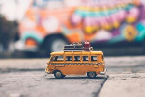 Selective focus photography of yellow school bus die cast